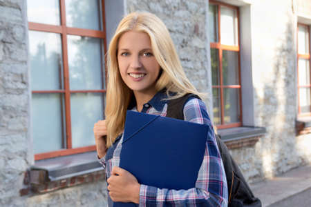 portrait of beautiful school girl at the college campusの写真素材