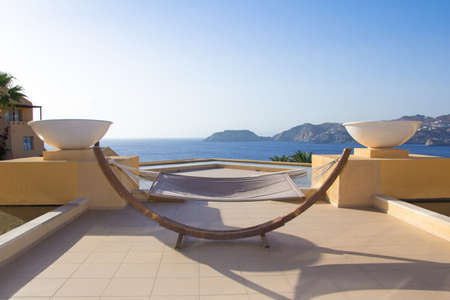 hammock with beautiful sea view in luxurious hotelの写真素材