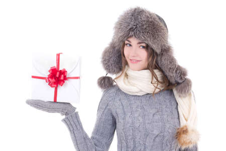 happy young beautiful woman in winter clothes with christmas present isolated on white backgroundの写真素材