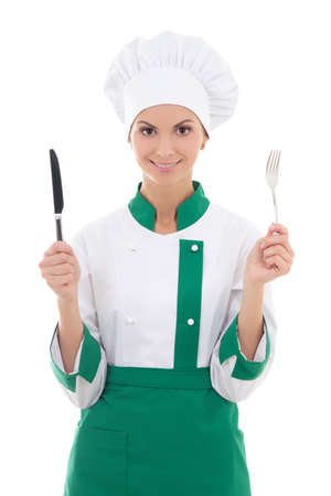 woman chef in uniform holding fork and knife isolated on white backgroundの写真素材