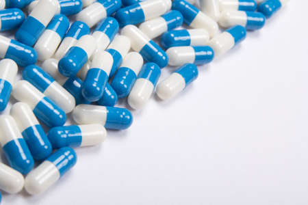 heal of blue pills or tablets on white backgroundの写真素材