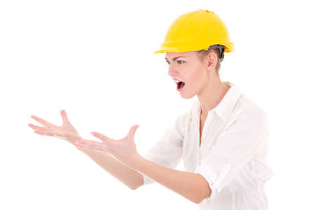 angry business woman architect in yellow builder helmet shouting isolated on white backgroundの写真素材