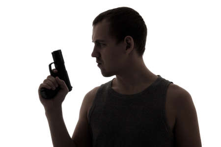 silhouette of criminal man holding gun isolated on white background
