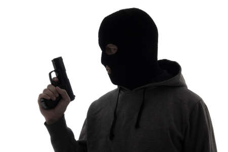 silhouette of criminal man in mask holding gun isolated on white background