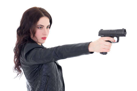 young beautiful woman shooting with gun isolated on white backgroundの写真素材