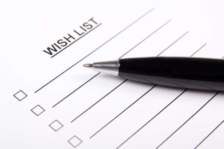 paper with blank wish list and metal penの写真素材
