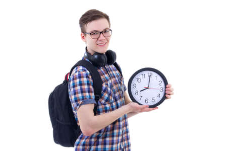 portrait of handsome teenage boy with backpack and office clock isolated on white backgroundの写真素材