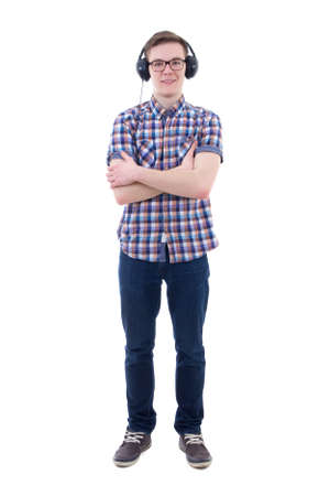 handsome teenage boy listening music with headphones isolated on white backgroundの写真素材