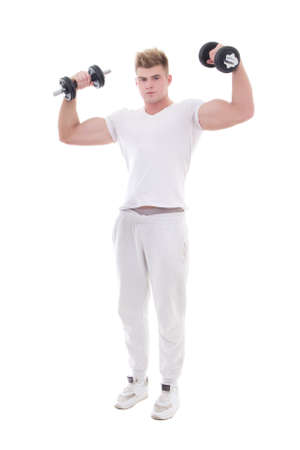 young handsome man in sportswear doing exercises with dumbbells isolated on white backgroundの写真素材