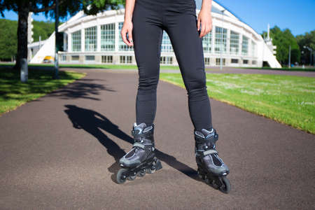 Inline skates - close up of slim female legs in skatesの写真素材