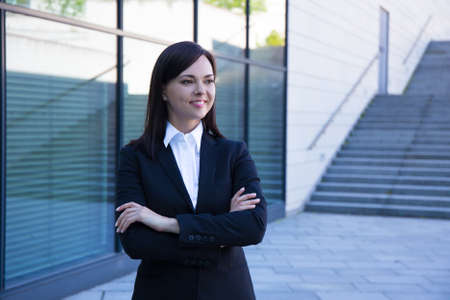 career concept - young beautiful business woman over modern city backgroundの写真素材