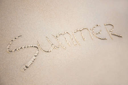 close up of word "summer" written in white sandの写真素材