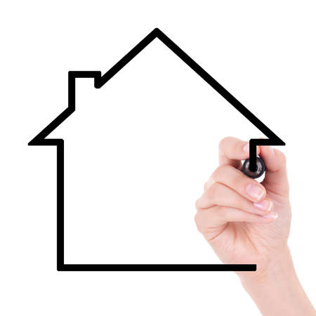 woman hand drawing house with marker isolated on white backgroundの写真素材