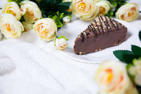 close up of chocolate cake and flowers with copy spaceの写真素材