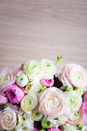 top view of bunch of summer flowers over wooden backgroundの写真素材