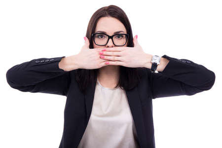 censorship concept - stressed young business woman covering her mouth isolated on white background