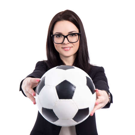 portrait of young business woman with soccer ball isolated on white backgroundの写真素材