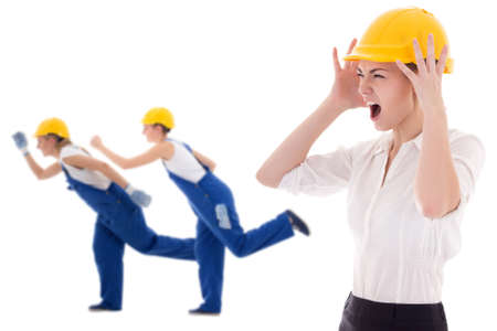 stress at work -business woman architect in yellow builder helmet shouting on workers isolated on white backgroundの写真素材