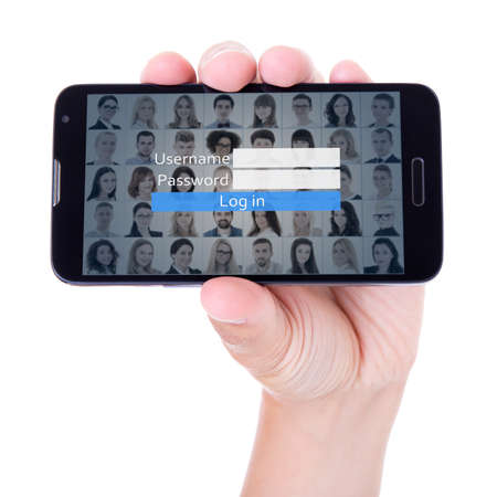 social network login concept - mobile smart phone in hand isolated on white backgroundの写真素材