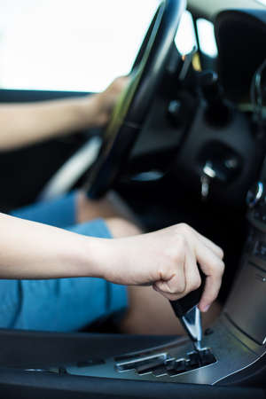close up of driver hand shifting the gear stickの写真素材