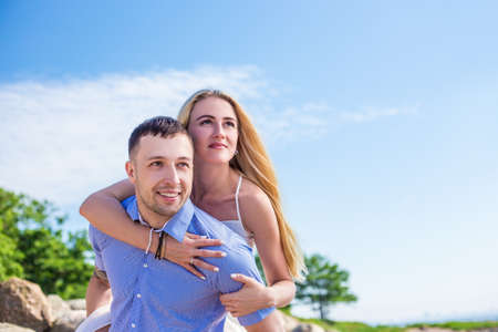 romantic portrait of happy young couple in love on summer beachの写真素材