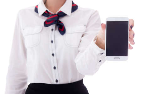 travel and booking concept - stewardess holding smart phone with blank screen isolated on white backgroundの写真素材