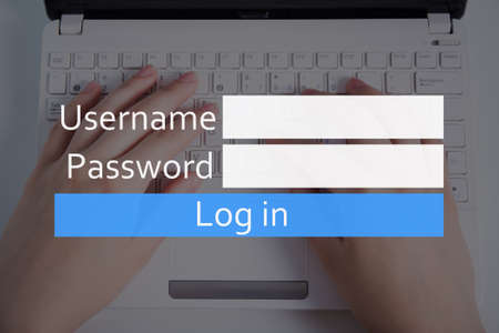 internet and account registration concept - login box and hands on keyboardの写真素材