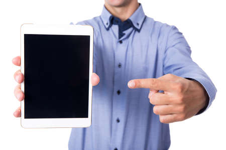 business man pointing on tablet pc with blank screen isolated on white backgroundの写真素材