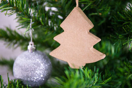 close up of handmade cardboard decoration on Christmas treeの写真素材