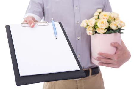flowers delivery - flowers and blank clipboard in male hands isolated on white backgroundの写真素材