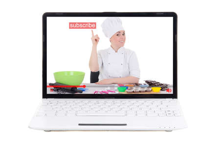 food video blog concept - woman making food and pointing at subscribe button on laptop screen isolated on white backgroundの写真素材