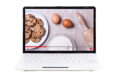 food blog concept - video about cooking on screen of laptop isolated on whiteの写真素材
