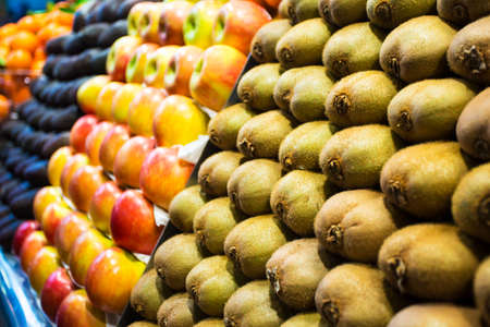 close up of fresh organic fruits on market stallの写真素材