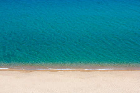 travel background - beautiful aerial view of sandy beach and blue sea