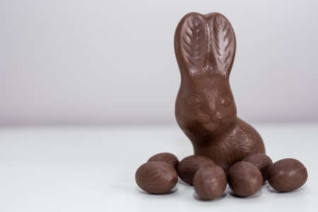 Easter concept - close up of chocolate bunny and sweets with copy spaceの写真素材
