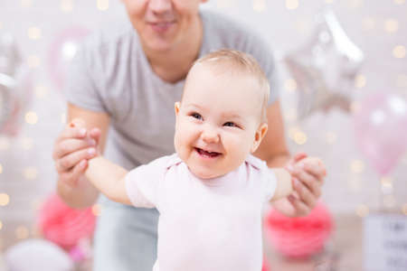 close up portrait of cute little baby girl and her fatherの写真素材