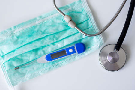 medicine, health care and pandemic concept - close up of doctor's equipment. stethoscope, protective...