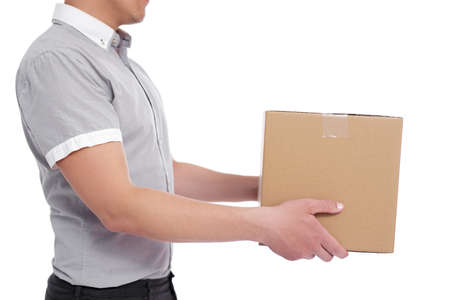 delivery concept - side view close up of a man giving box isolated on white backgroundの写真素材