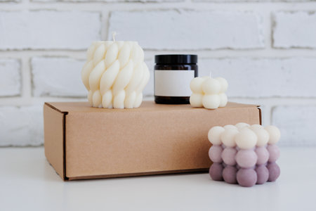Set of aroma candles on a box on tableの写真素材