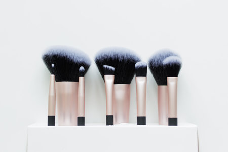 set of make up brushes over white background