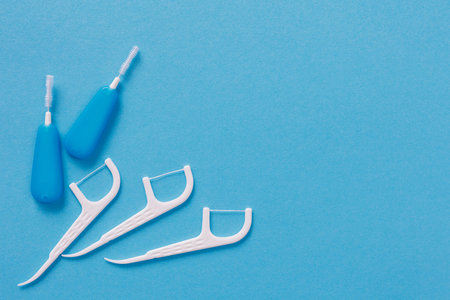Top view of dental toothpicks on blue background with copyspaceの写真素材