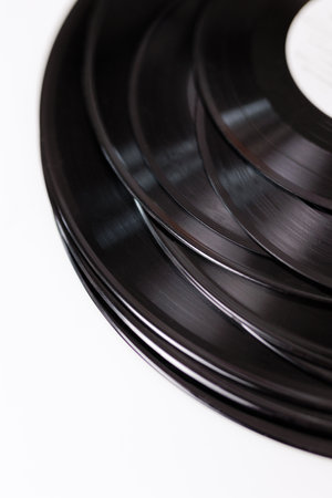 A bunch of old vinyl disks on white backgroundの写真素材