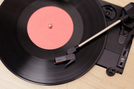 Top view of vintage phonograph playing a black vynil recordの写真素材
