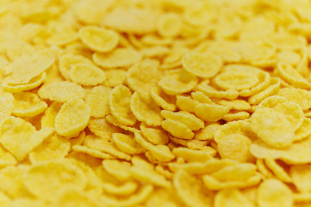 Breakfast concept - Close up of golden crunchy cornflakesの写真素材