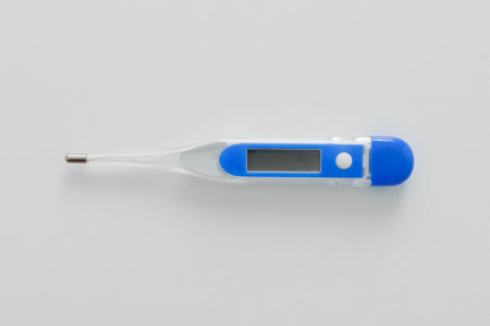 Blue electronic modern thermometer on white background