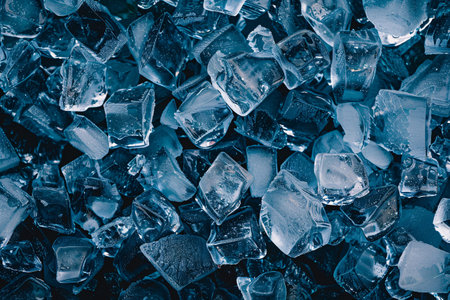 close up top view of ice cubes over dark backgroundの素材