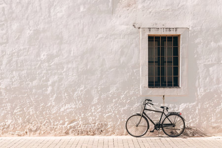 bicycle near white wall background with copy spaceの素材