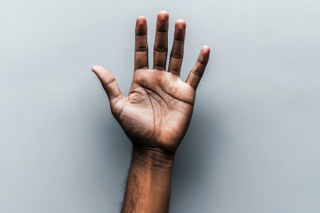 open hand with copy space on grey background with copy spaceの素材