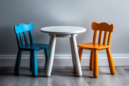 children's table with chairs on the white wall backgroundの素材