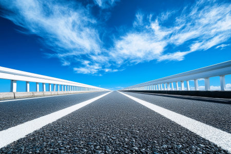 long road with a blue skyの素材